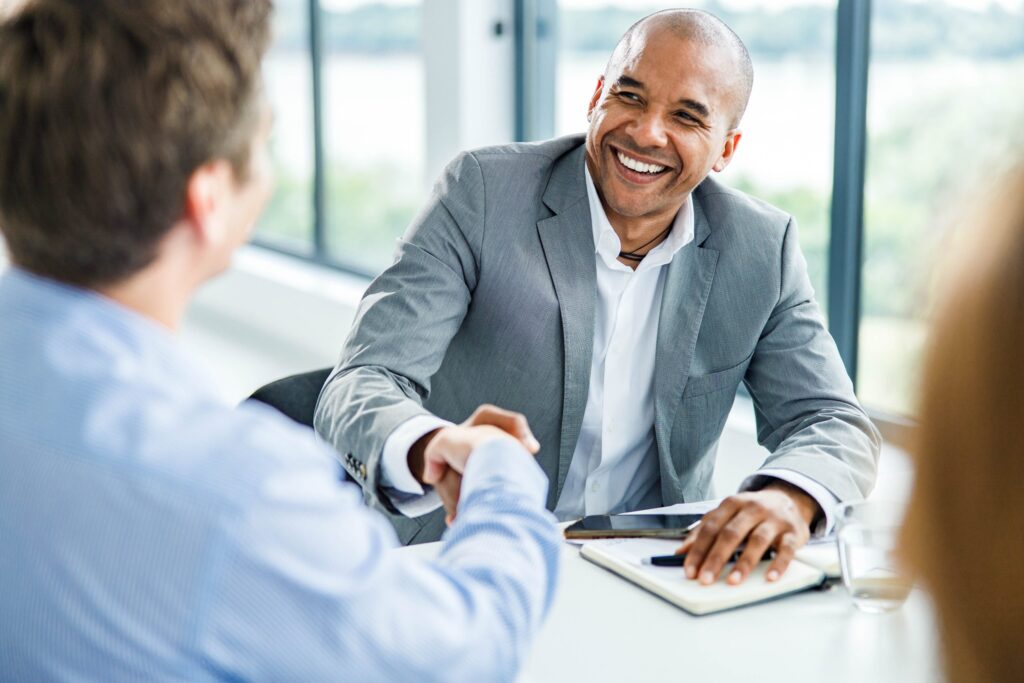 Two men shaking hands in a business meeting